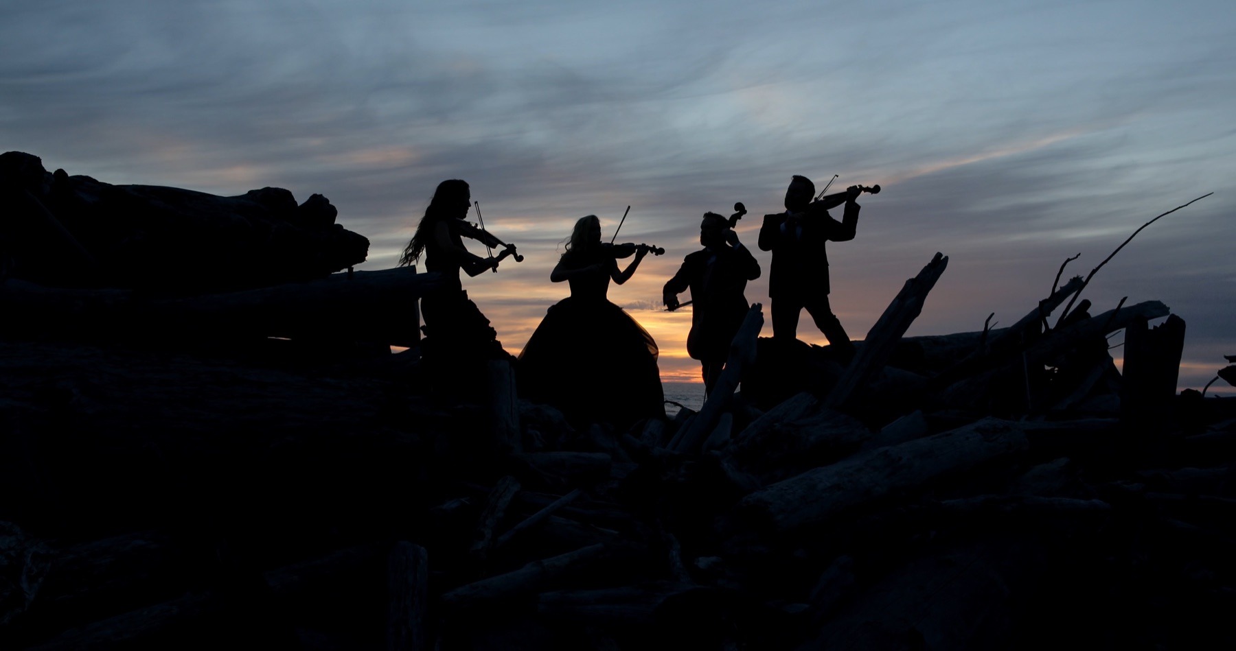 The Annie Moses Band silhouetted at sunset